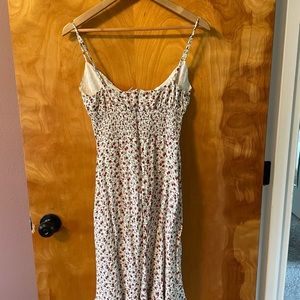 Flora dress with smocking and tie front detail.